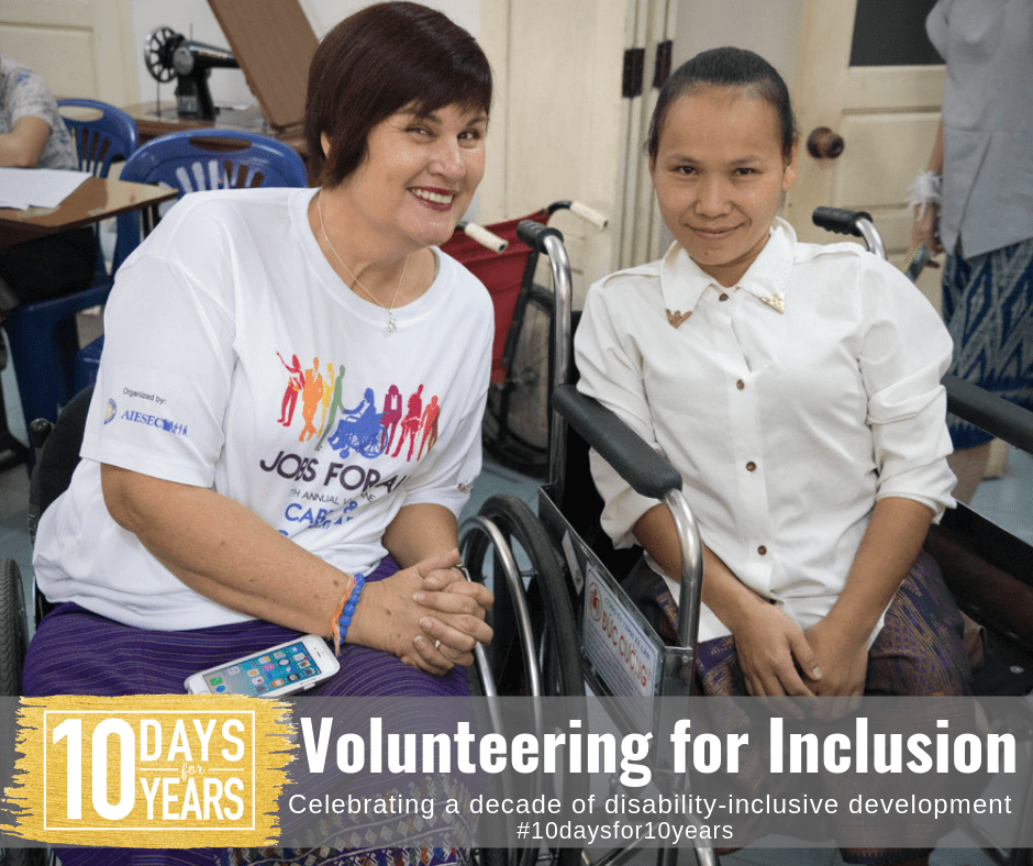 Photo of Chris with a student from the Lao Disabled Womens Centre. Text on photo says Volunteering for Inclusion, celebrating a decade of disability-inclusive development.